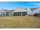 Expansive backyard featuring a screened porch, perfect for outdoor living and entertaining at 125 Leeward Landing, Summerville, SC 29486