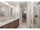 Bathroom featuring double sinks, a walk-in shower, and access to a walk-in closet at 125 Leeward Landing, Summerville, SC 29486