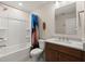 Clean bathroom with a bathtub, shower curtain, and a modern sink with brown cabinets below at 125 Leeward Landing, Summerville, SC 29486