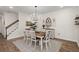 Charming dining room with a modern chandelier, staircase access, and elegant decor at 125 Leeward Landing, Summerville, SC 29486