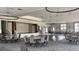 Spacious event space with round tables, ample seating, and elegant chandelier lighting for your next gathering at 125 Leeward Landing, Summerville, SC 29486