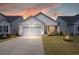 Charming single-Gathering home featuring a two-car garage, inviting front porch, and well-maintained landscaping at 125 Leeward Landing, Summerville, SC 29486