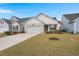 Beautiful single-story home featuring a well-maintained lawn and classic architectural design at 125 Leeward Landing, Summerville, SC 29486