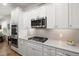 Modern kitchen featuring stainless steel appliances, sleek white cabinetry, and a bright, clean design at 125 Leeward Landing, Summerville, SC 29486