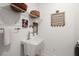 Functional laundry room sink, hanging rack, and shelving for organized storage at 125 Leeward Landing, Summerville, SC 29486