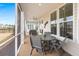Relaxing screened-in porch featuring a ceiling fan and comfortable seating at 125 Leeward Landing, Summerville, SC 29486