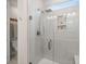 Modern bathroom shower with glass door and tiled walls, with recessed niche shelving for accessories at 125 Leeward Landing, Summerville, SC 29486