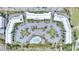 Aerial view of condo buildings with a swimming pool and ample parking, close to the beach and sand dunes at 1300 Ocean Blvd # 232, Isle of Palms, SC 29451