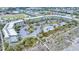 Aerial view of beachfront condos with a swimming pool, parking, and easy beach access at 1300 Ocean Blvd # 232, Isle of Palms, SC 29451