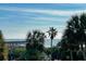 Picturesque view with palm trees and the fishing pier on the beautiful coast line at 1300 Ocean Blvd # 232, Isle of Palms, SC 29451