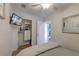 Relaxing bedroom featuring a television, closet and access to the adjacent room at 1300 Ocean Blvd # 232, Isle of Palms, SC 29451
