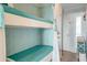 Charming built-in bunk beds featuring turquoise colored coverings at 1300 Ocean Blvd # 232, Isle of Palms, SC 29451