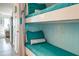 Charming built-in bunk beds featuring turquoise colored coverings at 1300 Ocean Blvd # 232, Isle of Palms, SC 29451