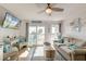 Cozy living room features beachy decor, comfortable seating, and sliding glass doors to the balcony at 1300 Ocean Blvd # 232, Isle of Palms, SC 29451