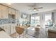 Bright living space with kitchen, balcony, and ocean-themed decor creating a cozy coastal retreat at 1300 Ocean Blvd # 232, Isle of Palms, SC 29451