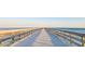 Straight-on shot of the community's pier running out into the ocean at 1300 Ocean Blvd # 232, Isle of Palms, SC 29451