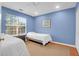Cozy bedroom featuring two beds, a window with natural light, and a ceiling fan at 1310 Pilsdon Crest, Mount Pleasant, SC 29464