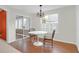 Cozy dining area with modern lighting fixture and large window for bright dining experience at 1310 Pilsdon Crest, Mount Pleasant, SC 29464