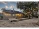 Backyard with large deck featuring built in lights, a lush yard, and mature trees at 1365 Whippoorwill Farm Rd, Johns Island, SC 29455
