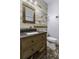Stylish bathroom features a wood accent wall and decorative tile flooring at 1365 Whippoorwill Farm Rd, Johns Island, SC 29455
