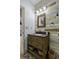 Stylish bathroom features a wood accent wall and decorative tile flooring at 1365 Whippoorwill Farm Rd, Johns Island, SC 29455