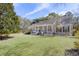 Lovely home featuring a covered front porch, well-maintained lawn, and lush landscaping for curb appeal at 1365 Whippoorwill Farm Rd, Johns Island, SC 29455