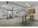 Spacious garage features weights, a work table, and lots of space at 1365 Whippoorwill Farm Rd, Johns Island, SC 29455