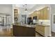 Kitchen featuring granite countertops, wooden cabinets, and modern appliances for a functional space at 1365 Whippoorwill Farm Rd, Johns Island, SC 29455