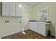 Laundry room with lots of cabinet space, sink, and natural light at 1365 Whippoorwill Farm Rd, Johns Island, SC 29455