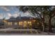 Large backyard with a multi-level deck, string lights, and mature trees adding to the atmosphere at 1365 Whippoorwill Farm Rd, Johns Island, SC 29455
