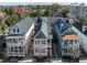 Aerial view of a two story home nestled in a quiet neighborhood at 15 Menotti St, Charleston, SC 29401