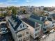 Aerial view showcases a neighborhood featuring charming homes and tree-lined streets at 15 Menotti St, Charleston, SC 29401