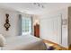 Bright bedroom features a comfortable bed, stylish decor, and a sun-filled window view at 15 Menotti St, Charleston, SC 29401