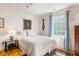 Bright bedroom features a comfortable bed, stylish decor, and a sun-filled window view at 15 Menotti St, Charleston, SC 29401