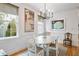 Elegant dining room boasting natural light, complemented by chic decor and hardwood floors at 15 Menotti St, Charleston, SC 29401