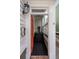 Inviting entryway with an orange front door and steps leading to a covered porch at 15 Menotti St, Charleston, SC 29401