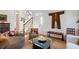 Comfortable living room featuring hardwood floors, stylish decor, and a staircase in the background at 15 Menotti St, Charleston, SC 29401