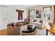 Cozy living room with hardwood floors, comfortable seating, and a glass coffee table at 15 Menotti St, Charleston, SC 29401