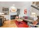 Bright living room with built-in bookshelves, fireplace, hardwood floors, and stylish modern furniture at 15 Menotti St, Charleston, SC 29401