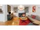 Inviting living room featuring built-in shelving, a fireplace, and comfortable seating arrangements at 15 Menotti St, Charleston, SC 29401