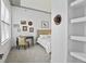 Bright bedroom with unique art and decor plus stylish desk and chair near window at 150 Bee St # 312, Charleston, SC 29401