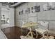 Cozy dining area featuring a rustic wooden table and exposed concrete wall at 150 Bee St # 312, Charleston, SC 29401