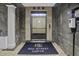 Elegant elevator lobby with modern finishes, tiled floors, and a convenient hand sanitizing station at 150 Bee St # 312, Charleston, SC 29401
