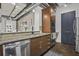 Well-equipped kitchen features granite countertops, stainless steel appliances, and stylish wooden cabinetry at 150 Bee St # 312, Charleston, SC 29401