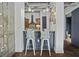 Stylish kitchen with bar seating and sleek blue cabinetry at 150 Bee St # 312, Charleston, SC 29401