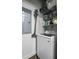 Functional laundry room with modern appliances and convenient storage shelving at 150 Bee St # 312, Charleston, SC 29401