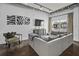 Cozy living room boasts a comfortable gray sofa, industrial-style lighting, and modern decor at 150 Bee St # 312, Charleston, SC 29401