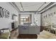 Modern living room featuring exposed ductwork, string lights, a gray sofa, and an open patio at 150 Bee St # 312, Charleston, SC 29401