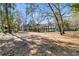 Backyard view of condo buildings with mature trees at 1715 Greystone Blvd Blvd # 25, Mount Pleasant, SC 29464