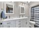 Bright bathroom features a white double vanity with ample storage space and well-lit mirrors at 1715 Greystone Blvd Blvd # 25, Mount Pleasant, SC 29464